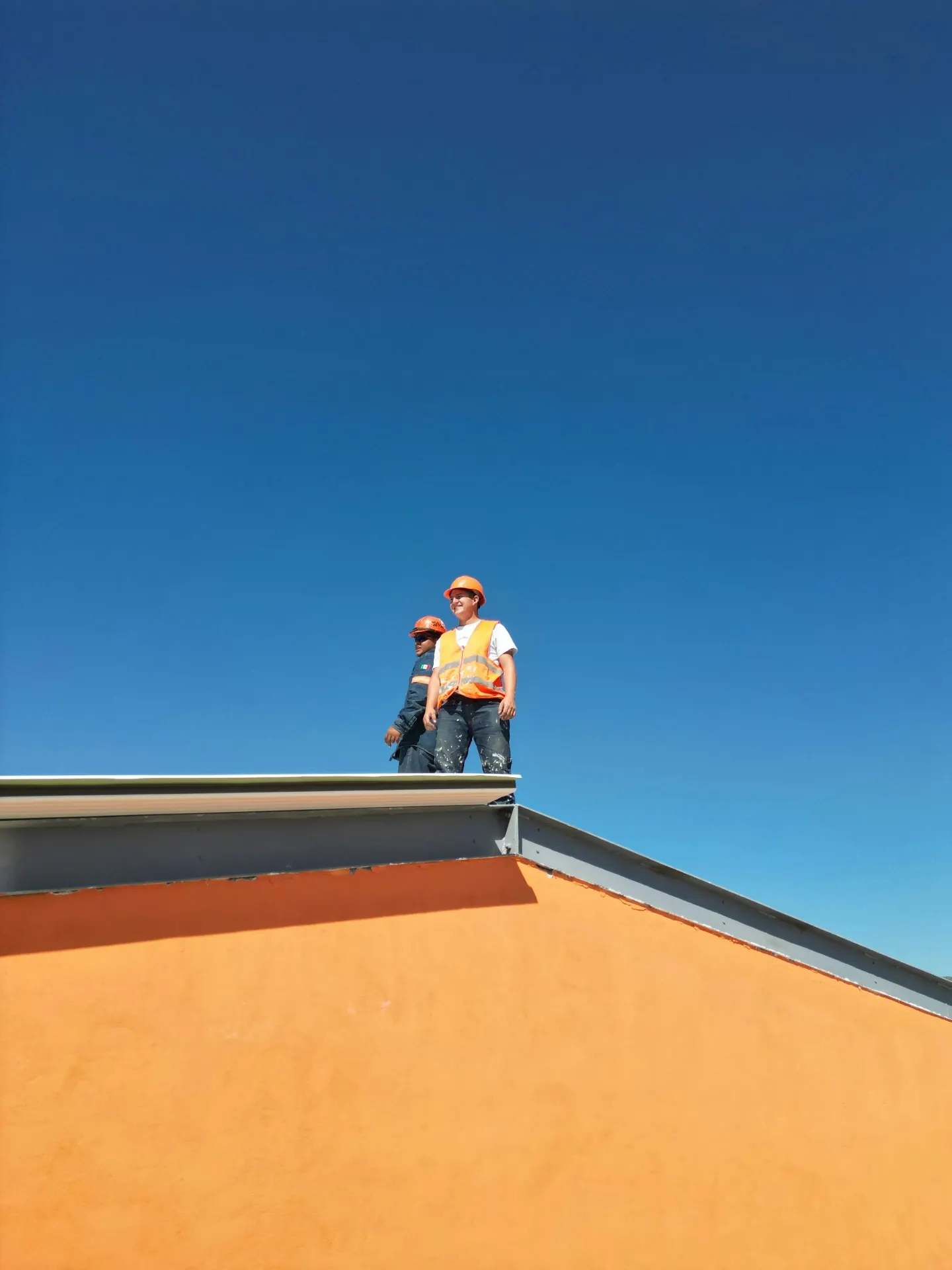 Roofing crew working on a commercial job site in Connecticut — service business generating more leads with Vibras